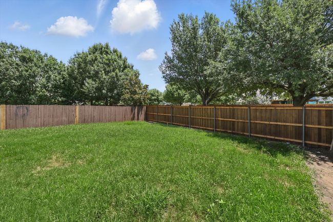 View of fenced backyard | Image 27