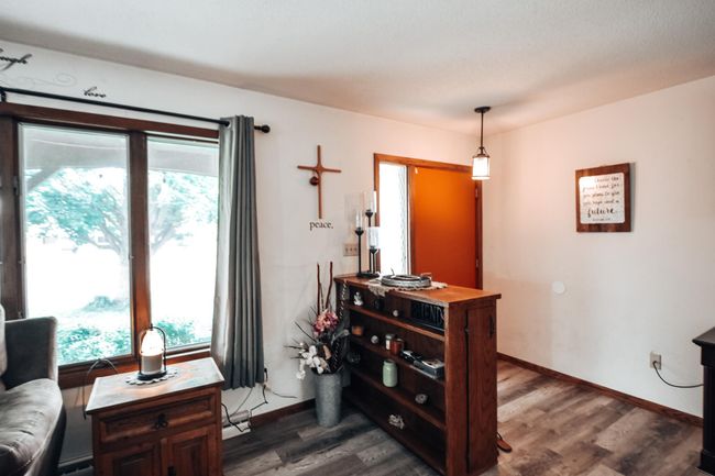 Spacious entry, that opens right into the living and dining area. Plenty of space to put shoes, coats, and store or set items on the built-in in the entry way. | Image 4