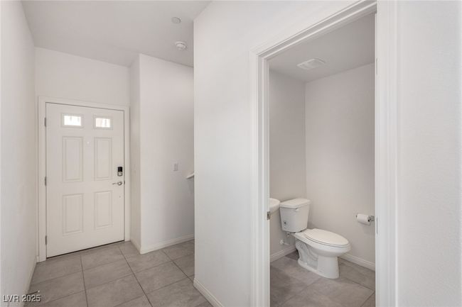 Entryway with baseboards and light tile patterned flooring | Image 4