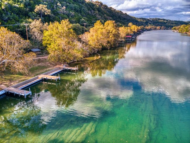 Water view with a boat dock and a heavily wooded area | Image 30