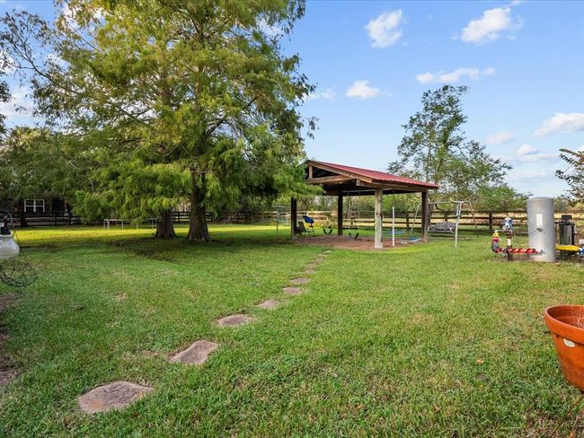 Walkway leading to a covered sandbox area for your little ones to enjoy | Image 11