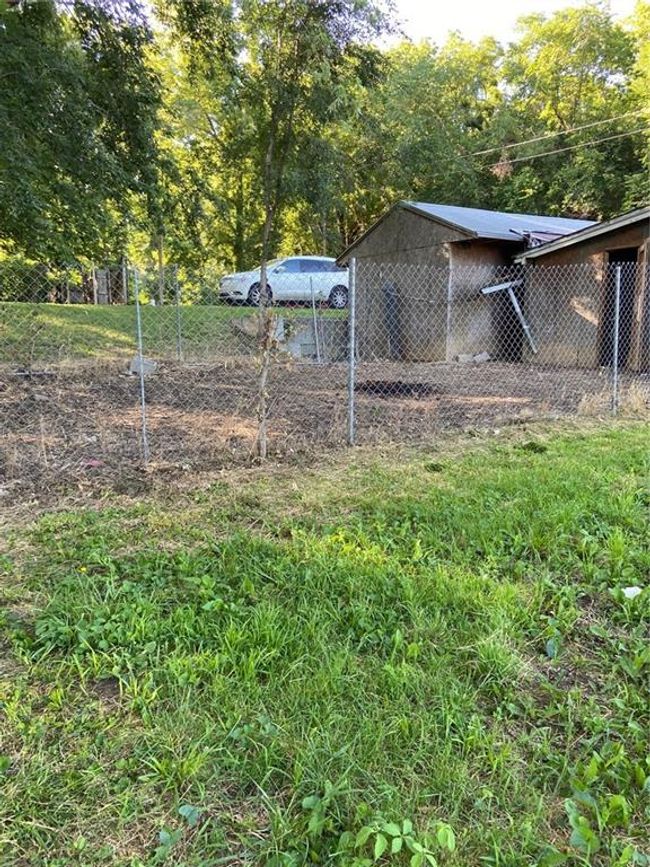 View of yard featuring an outdoor structure | Image 11