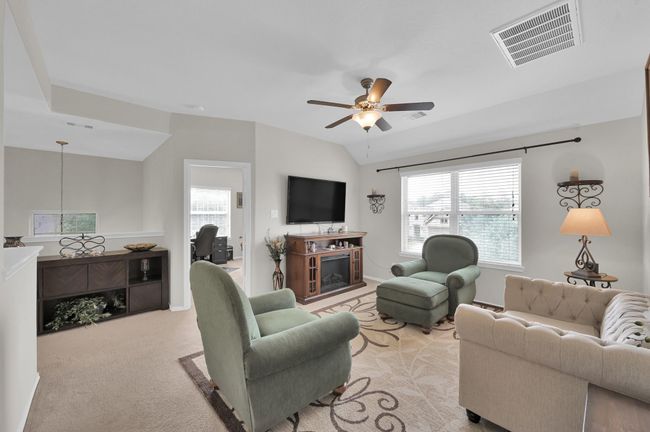 Heading upstairs you'll be greeted with a landing to the left, and a spacious game room, perfect for relaxing and entertaining. | Image 19
