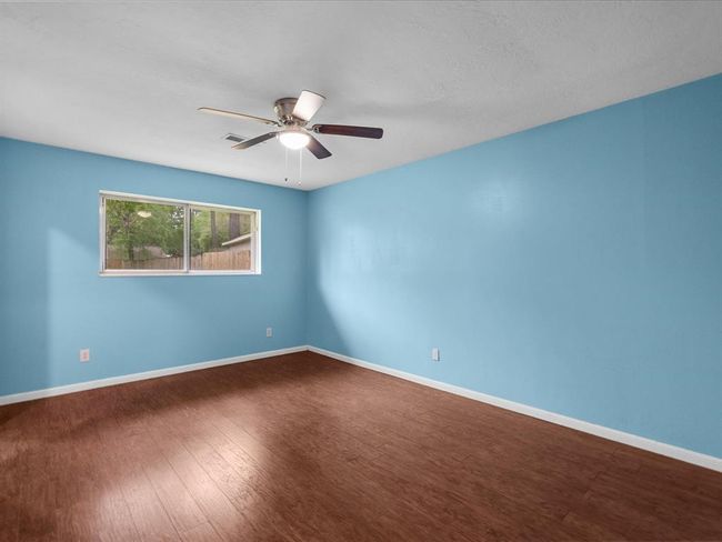 Primary leading into bathroom with stand up shower. | Image 17