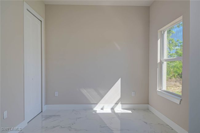 Unfurnished room with marble finish floor and baseboards | Image 10
