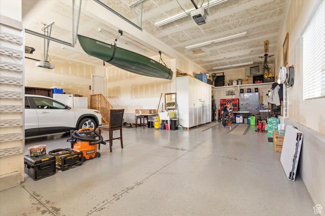 Garage with a garage door opener | Image 44