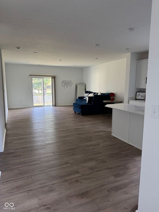 living area with dark wood-type flooring | Image 10