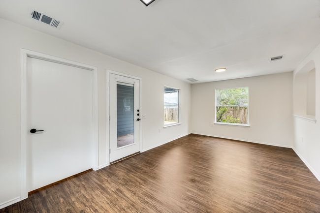 Unfurnished room with dark wood finished floors and baseboards | Image 19