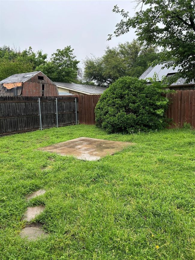 View of fenced backyard | Image 21