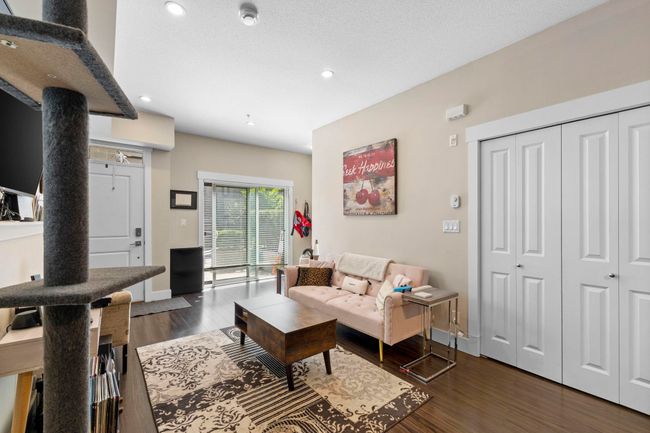 Living room with recessed lighting, baseboards, and dark wood-style flooring | Image 5