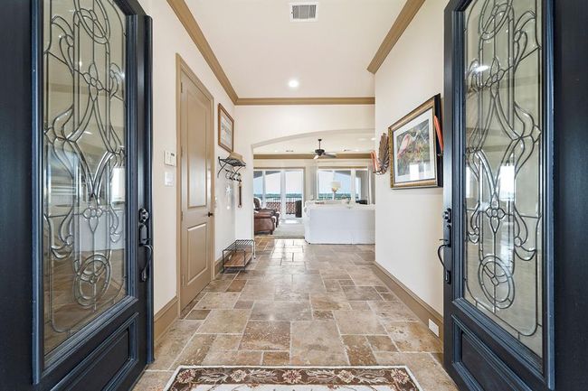 Stunning leaded glass front doors welcome you into a spacious and airy entryway | Image 5
