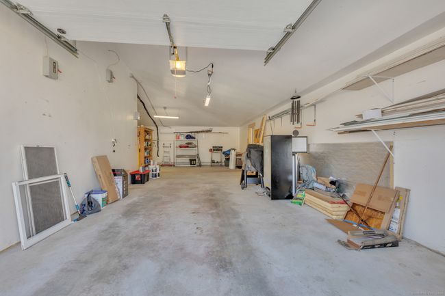 Massive Garage with seperate septic, 3-phase electrical, water, &amp; heat, Generator Transfer Switch &amp; Laundry area | Image 32