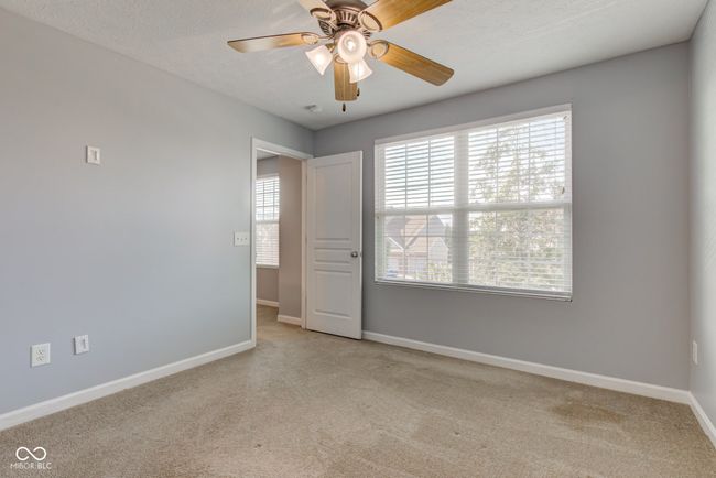 unfurnished room with carpet floors and ceiling fan | Image 45