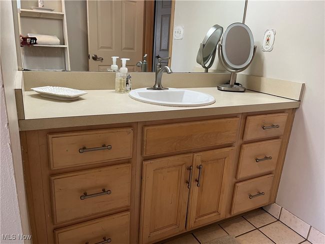 Bathroom featuring ceramic floors and vanity. | Image 32