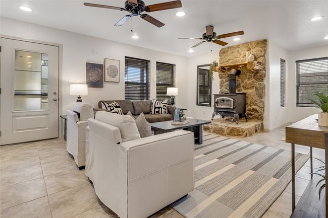Main house in living with wood burning stove | Image 12