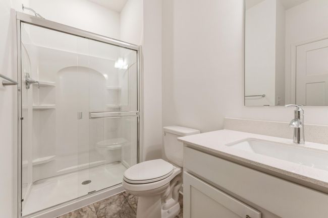 Photo is of the actual home. The main level bath. | Image 10