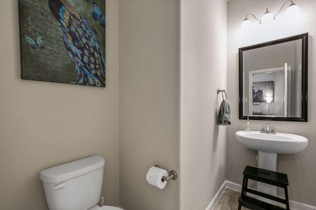 Half bathroom featuring toilet and baseboards | Image 14
