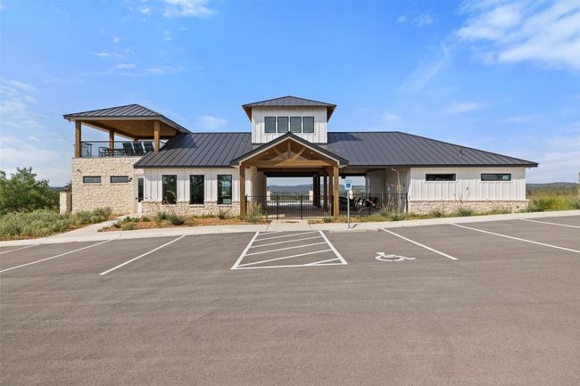 View of property featuring uncovered parking | Image 20