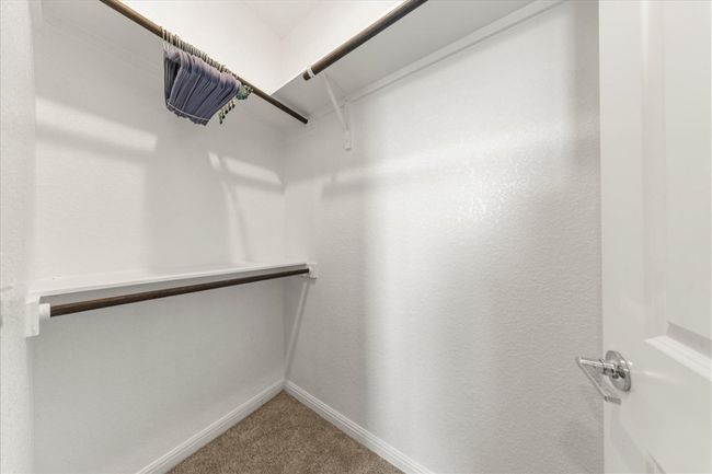 Spacious closet featuring carpet flooring | Image 31