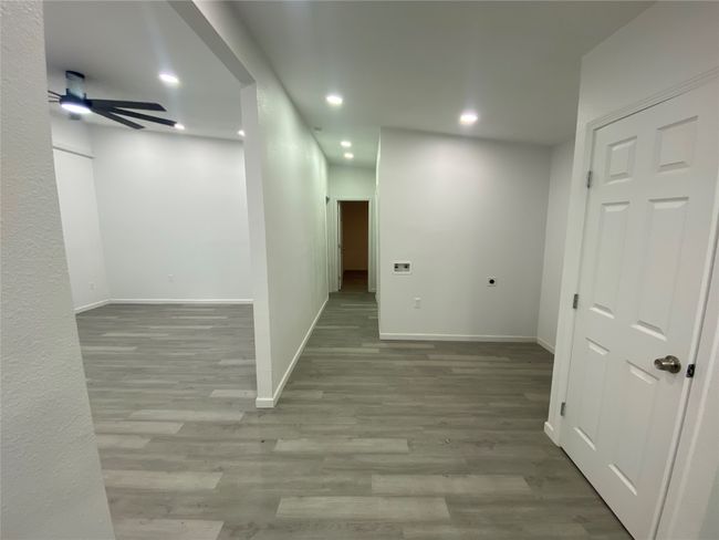 Hallway with recessed lighting, wood finished floors, and baseboards | Image 6