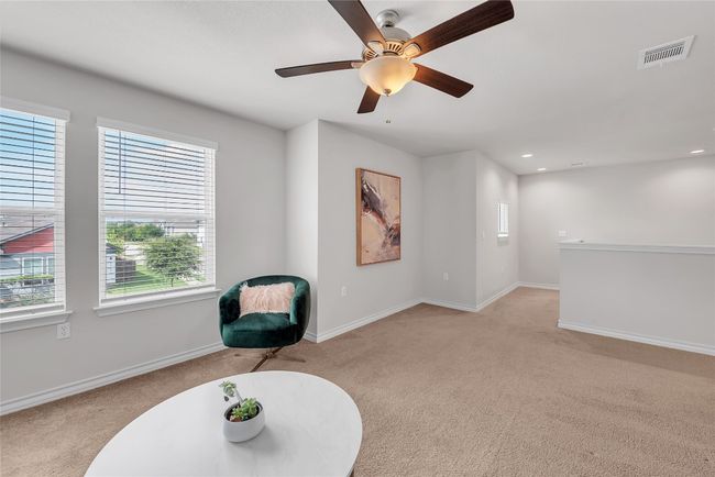 Living area with light colored carpet, healthy amount of natural light, baseboards, and recessed lighting | Image 13