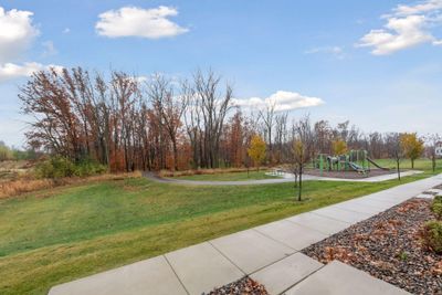 Step out to walking trails, open grassy area and playground | Image 3