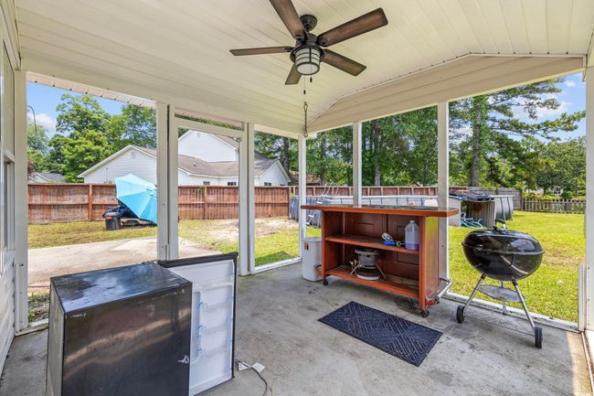 Sunroom with a ceiling fan and lofted ceiling | Image 37