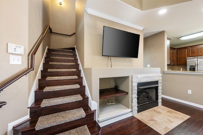 Stairs with recessed lighting, baseboards, a stone fireplace, and hardwood / wood-style floors | Image 21