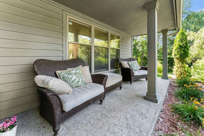 Step outside and take advantage of multiple inviting outdoor living areas. The charming 32x6 covered front porch is ideal for sipping your morning coffee or unwinding with a good book. | Image 19