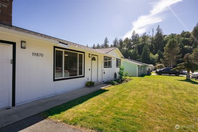 The home has a nice level front yard and a defined entry. | Image 2