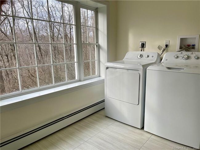 Large Laundry room with picture window looking at the backyard | Image 11