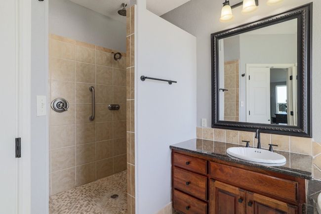 Large walk-in shower with multiple faucets. | Image 20