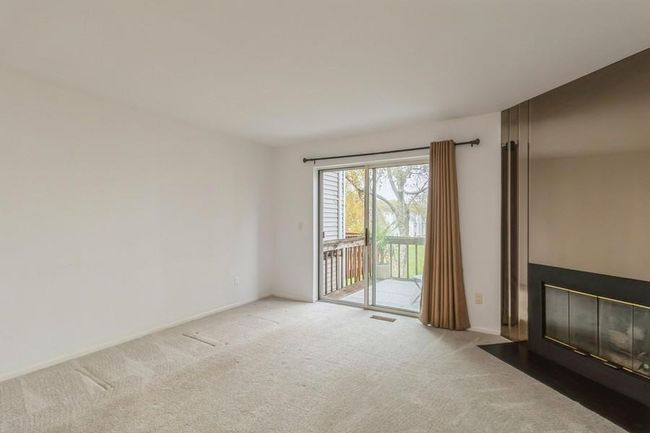Living room featuring a fireplace | Image 12