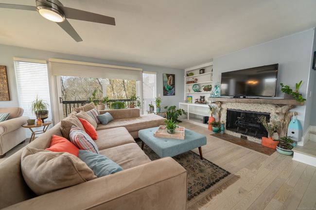 Living room with fireplace and sliders to deck | Image 4