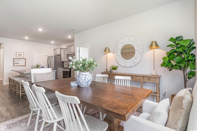 Dining room featuring wood-type flooring | Image 8