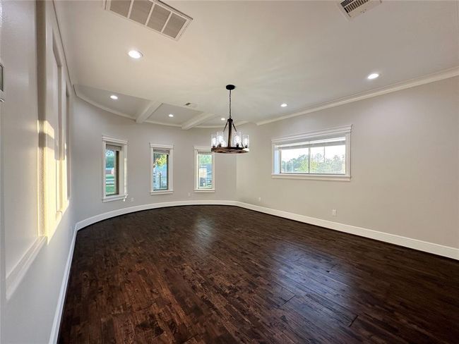 This dining space would make an ideal flex space for your home theater room or game room. It is located just off the family room and kitchen. | Image 10