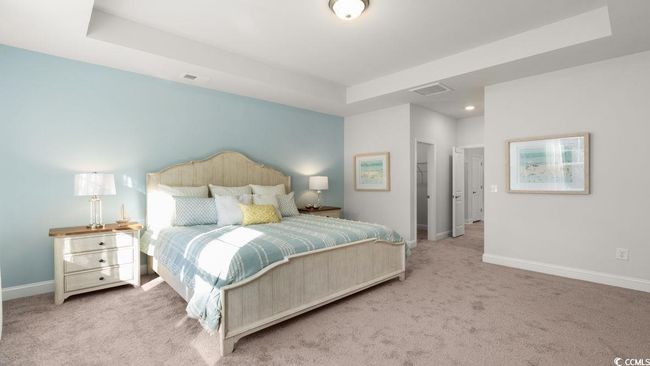 Bedroom featuring carpet flooring, baseboards, a tray ceiling, and recessed lighting | Image 16