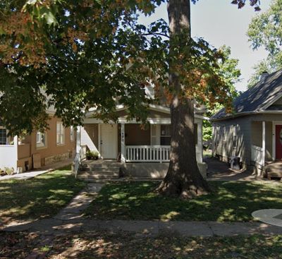 Bungalow featuring covered porch | Image 1