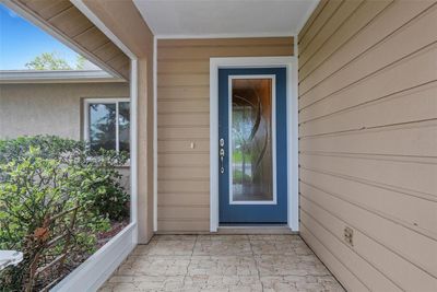 front porch with beautiful glass impact front door | Image 3