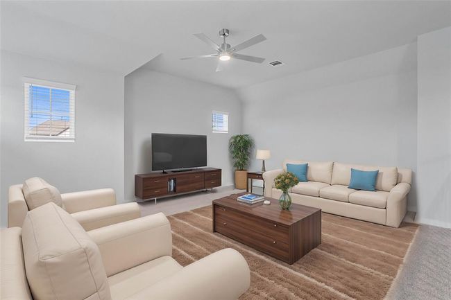 Perfect for entertaining is this amazing game room! Right upstairs this space would be a fabulous teen hangout, media room, or adult game room complete with enough room for a pool table and big screen TVs! Featuring plush carpet, high ceiling with ceiling fan, custom paint and windows with privacy blinds! | Image 13