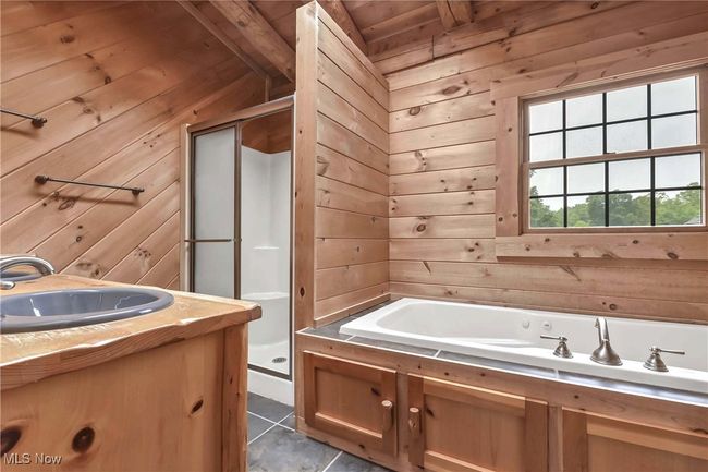 Primary bathroom with soaking tub, dual vanity and standalone shower | Image 25