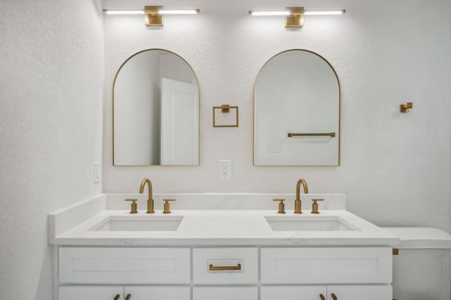 Bathroom with double vanity and toilet | Image 21