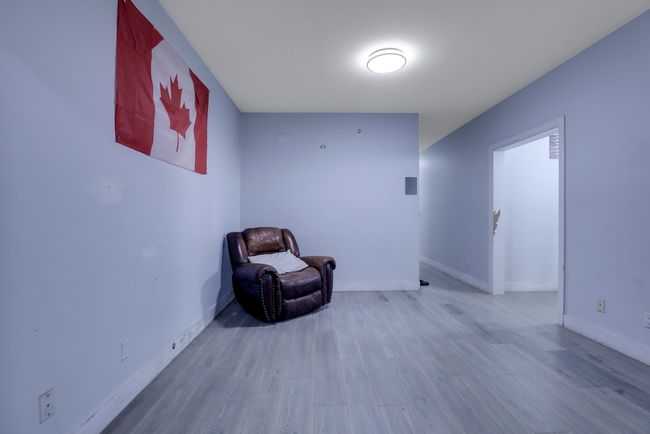 Unfurnished room with wood finished floors and baseboards | Image 32