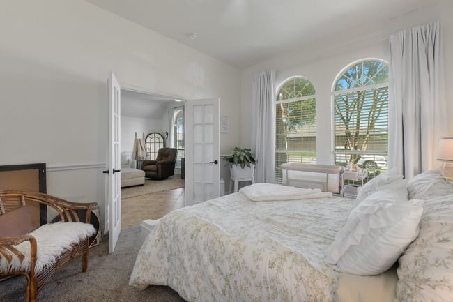 Tiled bedroom with french doors and carpet flooring | Image 8