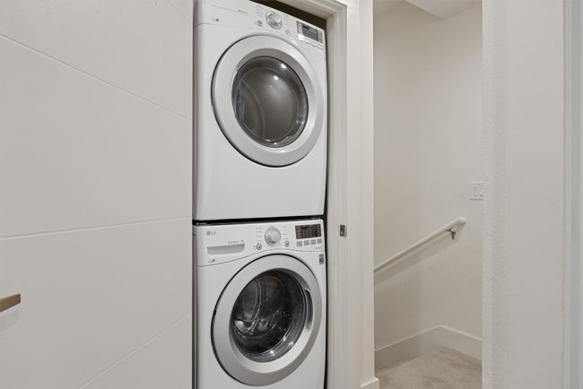 Laundry area with stacked washer / drying machine | Image 13