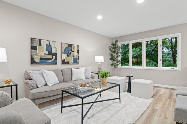 Expansive windows with tranquil wooded views—perfect for relaxing or entertaining in style | Image 4