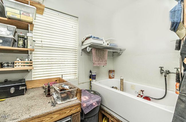 Downstairs tub and sink area in addition | Image 27