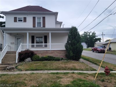 Front facade featuring a porch | Image 2