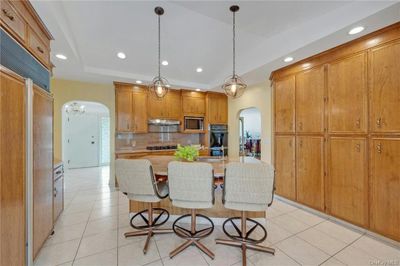 sizeable, Sub-Zero refrigerator, and plenty of cabinets for storage | Image 3