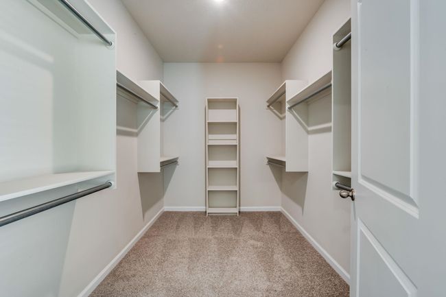 Spacious closet featuring carpet floors | Image 14